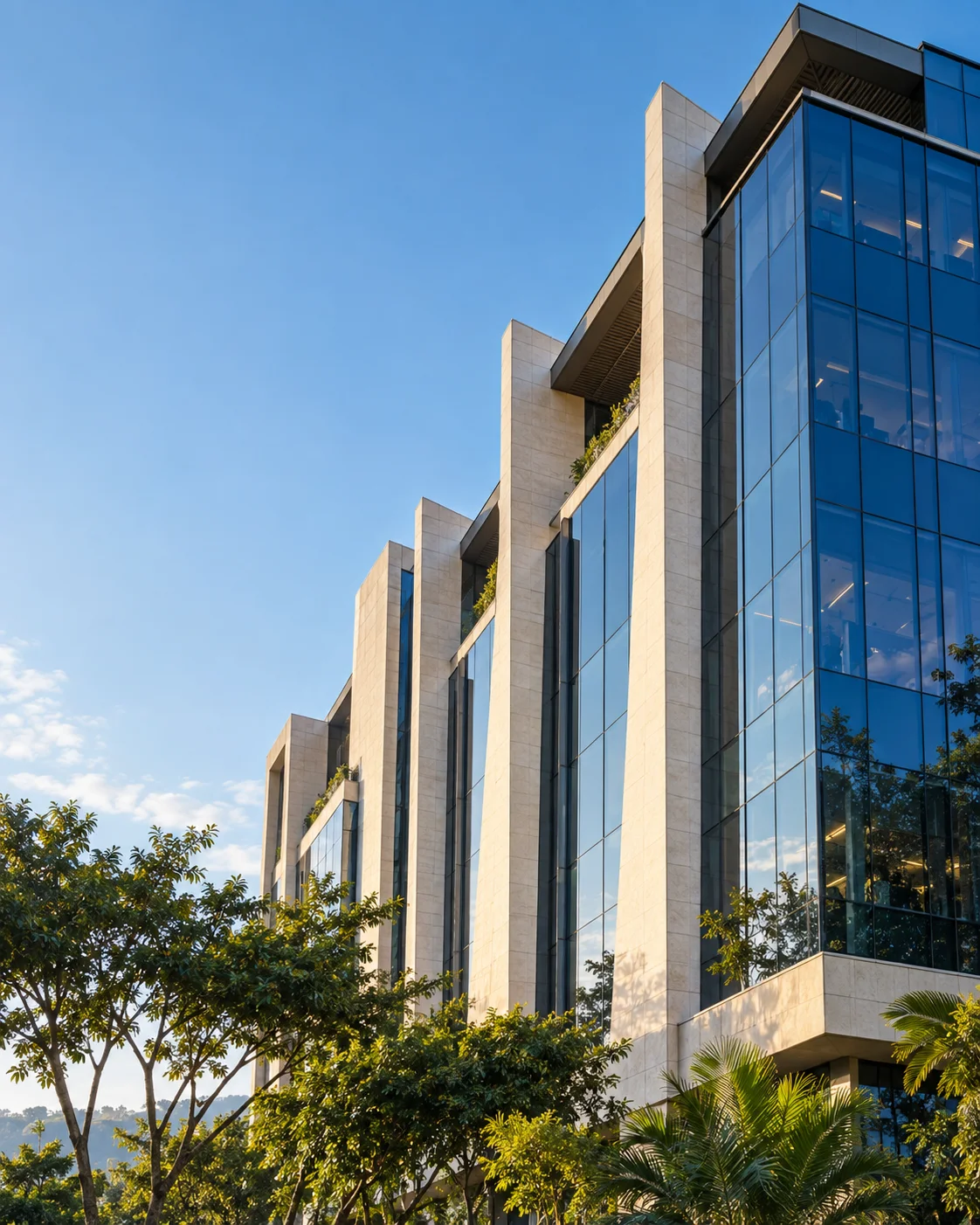 Conceptual architectural image of a modern building with blue glass and stone facades